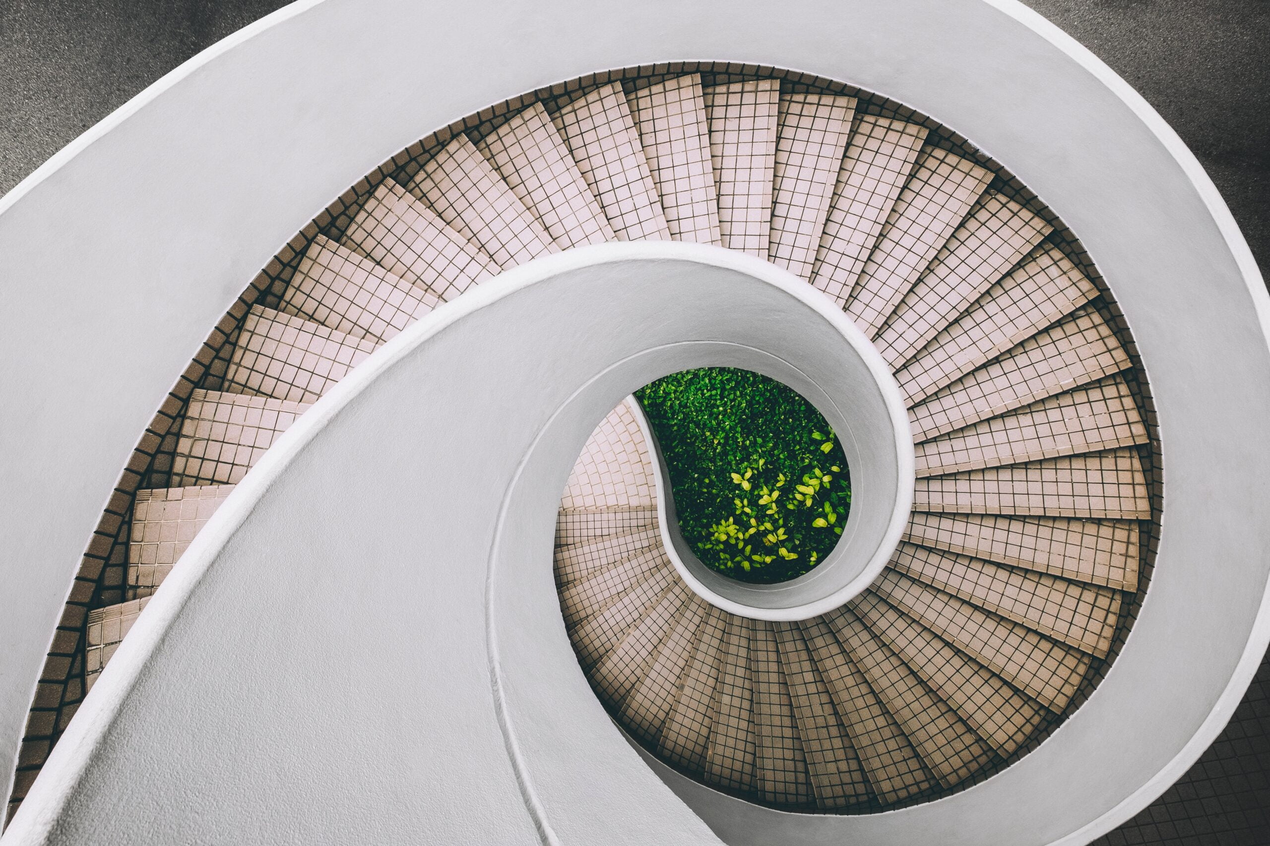 spiral staircase with green grass in centre
